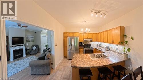 102 Willow Lane, Grimsby, ON - Indoor Photo Showing Kitchen With Fireplace With Double Sink
