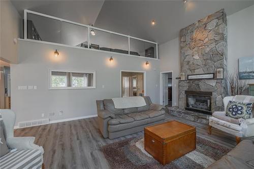 41 Brayden Dr, Arnes, MB - Indoor Photo Showing Living Room With Fireplace