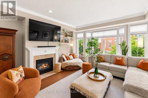 52 Kings Landing Private, Ottawa, ON - Indoor Photo Showing Living Room With Fireplace