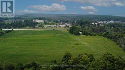 View looking south over acreage of property. - 