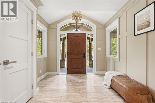 Vaulted entryway featuring a wood paneled door with an arched transom, recessed lighting, and tile flooring - 266 Ferndale Place, Waterloo, ON - Indoor Photo Showing Other Room