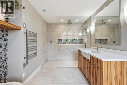 Spacious bathroom featuring a dual vanity with undermount sinks, a large walk-in shower with dual showerheads, and a built-in shower niche with mosaic tile - 266 Ferndale Place, Waterloo, ON - Indoor Photo Showing Bathroom