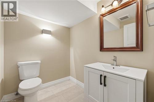 Bathroom featuring a white vanity with black hardware, a rectangular undermount sink, and a chrome faucet - 266 Ferndale Place, Waterloo, ON - Indoor Photo Showing Bathroom