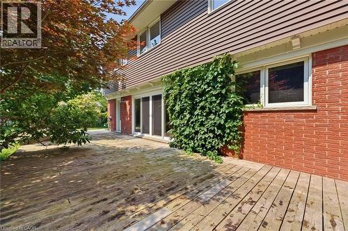 Expansive wood deck with a brick and horizontal siding exterior - 266 Ferndale Place, Waterloo, ON - Outdoor With Deck Patio Veranda With Exterior
