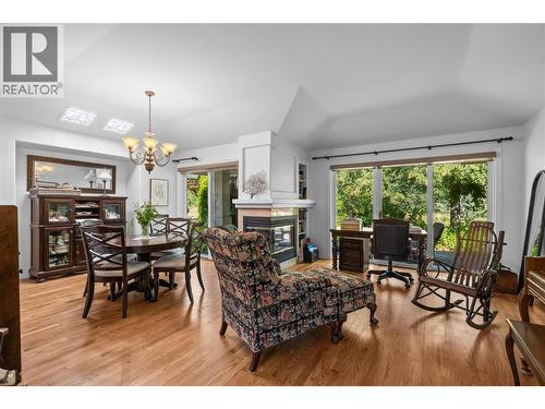 Living Room and Dining Room - 3889 Gallaghers Grange, Kelowna, BC - Indoor With Fireplace