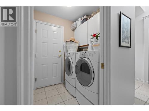 Laundry Room with garage access - 3889 Gallaghers Grange, Kelowna, BC - Indoor Photo Showing Laundry Room