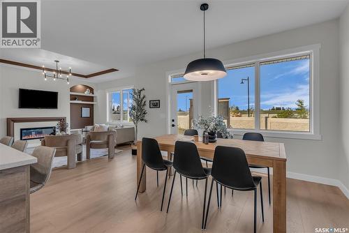463 Traeger Close, Saskatoon, SK - Indoor Photo Showing Dining Room With Fireplace