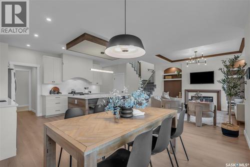 463 Traeger Close, Saskatoon, SK - Indoor Photo Showing Dining Room With Fireplace