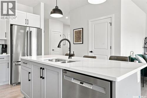 65 651 Dubois Crescent, Saskatoon, SK - Indoor Photo Showing Kitchen With Stainless Steel Kitchen With Double Sink With Upgraded Kitchen