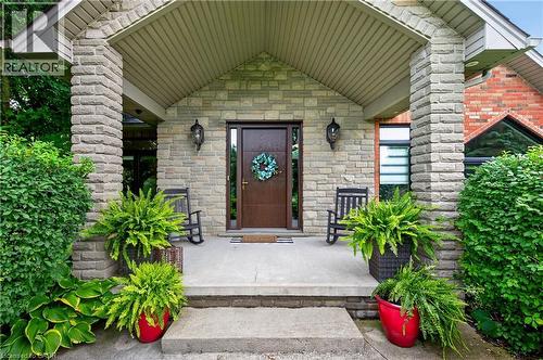 Stone facade entry with a covered porch - 2050 15 Side Road, Milton, ON - Outdoor