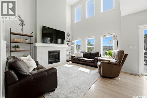5209 E Green Crescent, Regina, SK - Indoor Photo Showing Living Room With Fireplace
