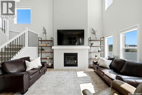 5209 E Green Crescent, Regina, SK - Indoor Photo Showing Living Room With Fireplace