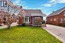 Brick residence featuring a prominent bay window and a dark shingle roof - 371 Ottawa Street S, Kitchener, ON  - Outdoor 