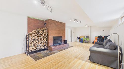 5740 Kennedy Road, Cranbrook, BC - Indoor Photo Showing Other Room With Fireplace