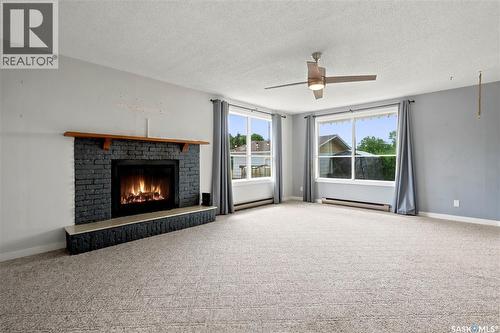 54 Hill Street, Eyebrow, SK - Indoor Photo Showing Living Room With Fireplace