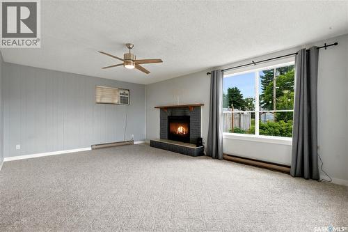 54 Hill Street, Eyebrow, SK - Indoor Photo Showing Living Room With Fireplace