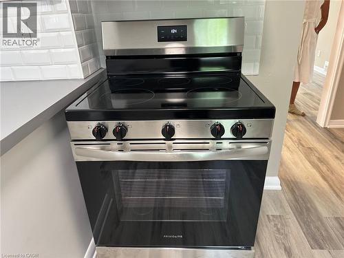 Stainless steel electric range with a black ceramic cooktop - 20 Lloyd Manor Road, Etobicoke, ON - Indoor Photo Showing Kitchen