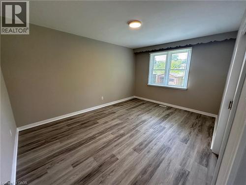 Room featuring wood-finish flooring, neutral wall tones, and white trim - 20 Lloyd Manor Road, Etobicoke, ON - Indoor Photo Showing Other Room