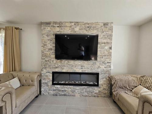 58 England Circle, Charlottetown, PE - Indoor Photo Showing Living Room With Fireplace
