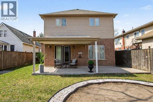 Rear exterior featuring a covered patio with direct access to the interior through double glass doors - 284 Normanhurst Avenue, Hamilton, ON - Outdoor With Deck Patio Veranda With Exterior