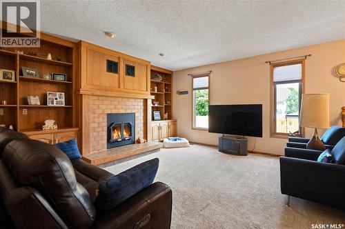 6112 Brunskill Place, Regina, SK - Indoor Photo Showing Living Room With Fireplace