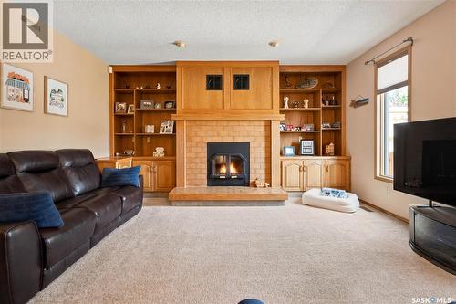 6112 Brunskill Place, Regina, SK - Indoor Photo Showing Living Room With Fireplace