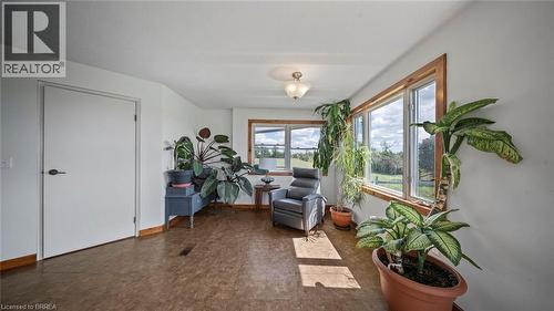 Bright interior space featuring multiple windows with wood trim, offering expansive outdoor scenery - 3211 Highway 3, Jarvis, ON - Indoor