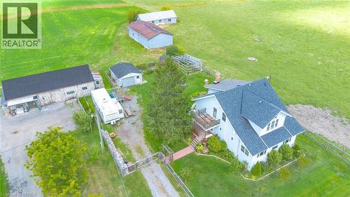 Expansive property featuring a multi-level residence with a gabled roof, multiple outbuildings, and extensive green space - 3211 Highway 3, Jarvis, ON - Outdoor With View