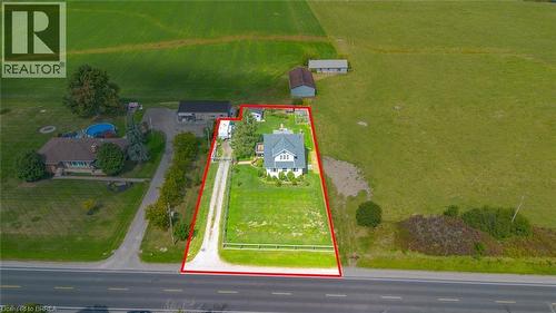 Gabled residence on a large grass lot with a gravel driveway - 3211 Highway 3, Jarvis, ON - Outdoor With View