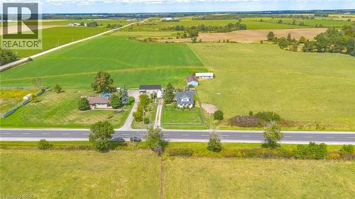 Expansive rural property featuring multiple residential structures, a detached garage, and a swimming pool - 3211 Highway 3, Jarvis, ON - Outdoor With View