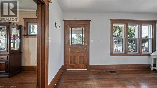 Interior with wood-finish flooring, a paneled door with glass insert, and a triple window assembly - 3211 Highway 3, Jarvis, ON - Indoor Photo Showing Other Room