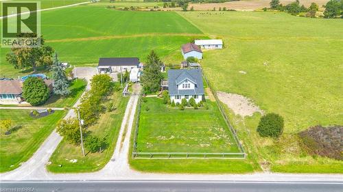 White residential structure featuring a dark roof, multiple gables, and a front porch - 3211 Highway 3, Jarvis, ON - Outdoor With View