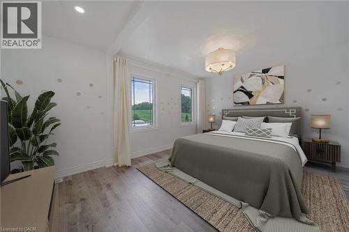 Bedroom featuring recessed lighting and a central drum chandelier - 7332 Twenty Road E, Glanbrook, ON - Indoor Photo Showing Bedroom