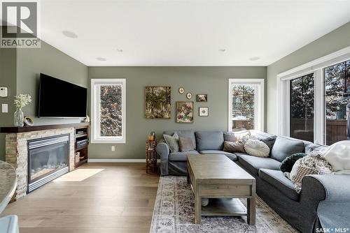 213 4002 Sandhill Crescent, Regina, SK - Indoor Photo Showing Living Room With Fireplace