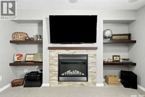 213 4002 Sandhill Crescent, Regina, SK - Indoor With Fireplace