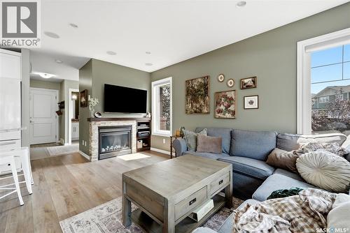 213 4002 Sandhill Crescent, Regina, SK - Indoor Photo Showing Living Room With Fireplace