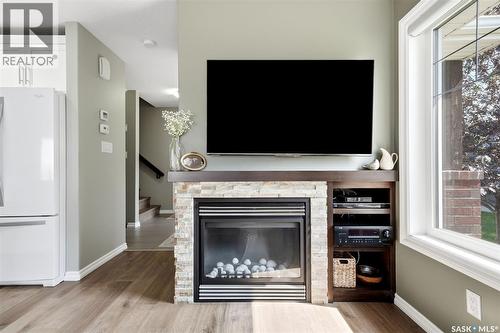 213 4002 Sandhill Crescent, Regina, SK - Indoor Photo Showing Living Room With Fireplace