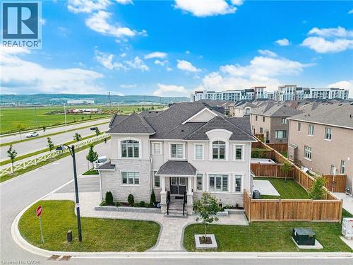 Contemporary two-story residence featuring a stone and stucco exterior - 542 Boyd Lane, Milton, ON - Outdoor