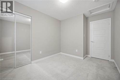 Room featuring light gray walls, white trim, and light gray carpet - 542 Boyd Lane, Milton, ON - Indoor Photo Showing Other Room