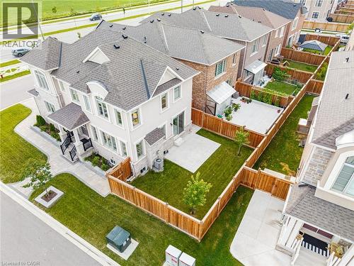 Modern two-story residence featuring a light-toned stucco and stone facade - 542 Boyd Lane, Milton, ON - Outdoor
