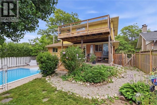 Virtually Staged - 101 Crosby Drive, Kitchener, ON - Outdoor With In Ground Pool With Deck Patio Veranda