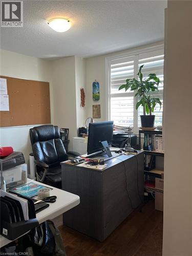 Dedicated workspace featuring wood-finish flooring, a flush-mount ceiling light fixture, and window shutters - 1367 Upper Paradise Road, Hamilton, ON - Indoor Photo Showing Office