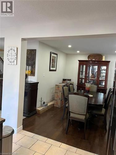 Dining area featuring wood-finish flooring, recessed lighting, and a clear architectural opening to an adjacent space - 1367 Upper Paradise Road, Hamilton, ON - Indoor Photo Showing Dining Room