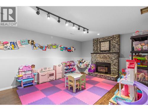 1035 Elwyn Road, Kelowna, BC - Indoor Photo Showing Other Room With Fireplace