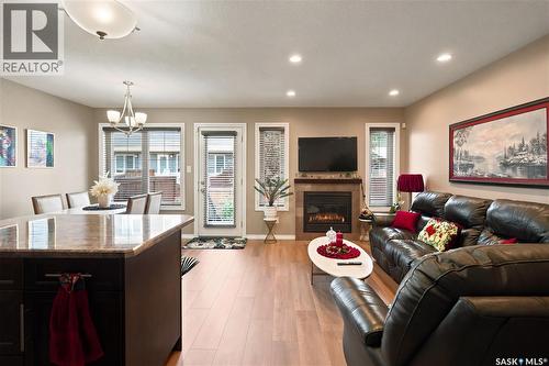 104 4100 Sandhill Crescent, Regina, SK - Indoor Photo Showing Living Room With Fireplace