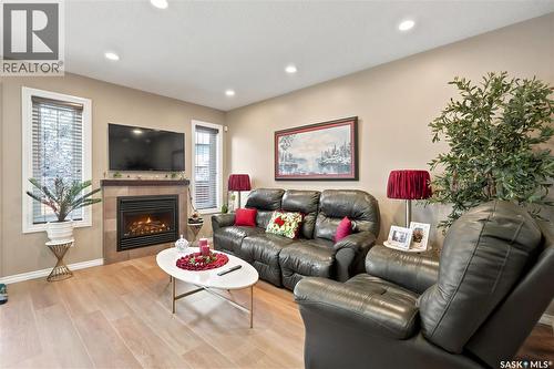 104 4100 Sandhill Crescent, Regina, SK - Indoor Photo Showing Living Room With Fireplace