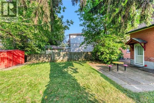 Expansive rear yard featuring a manicured lawn, perimeter fencing, and mature trees - 74 Royal Avenue, Hamilton, ON - Outdoor