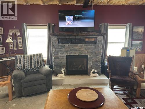 139 Lakeview Drive, Island View, SK - Indoor Photo Showing Living Room With Fireplace