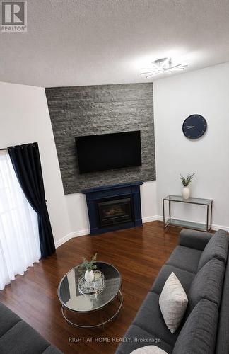 32 - 589 Beechwood Drive N, Waterloo, ON - Indoor Photo Showing Living Room With Fireplace