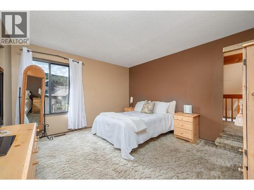 7807 Corona Court, Coldstream, BC - Indoor Photo Showing Bedroom